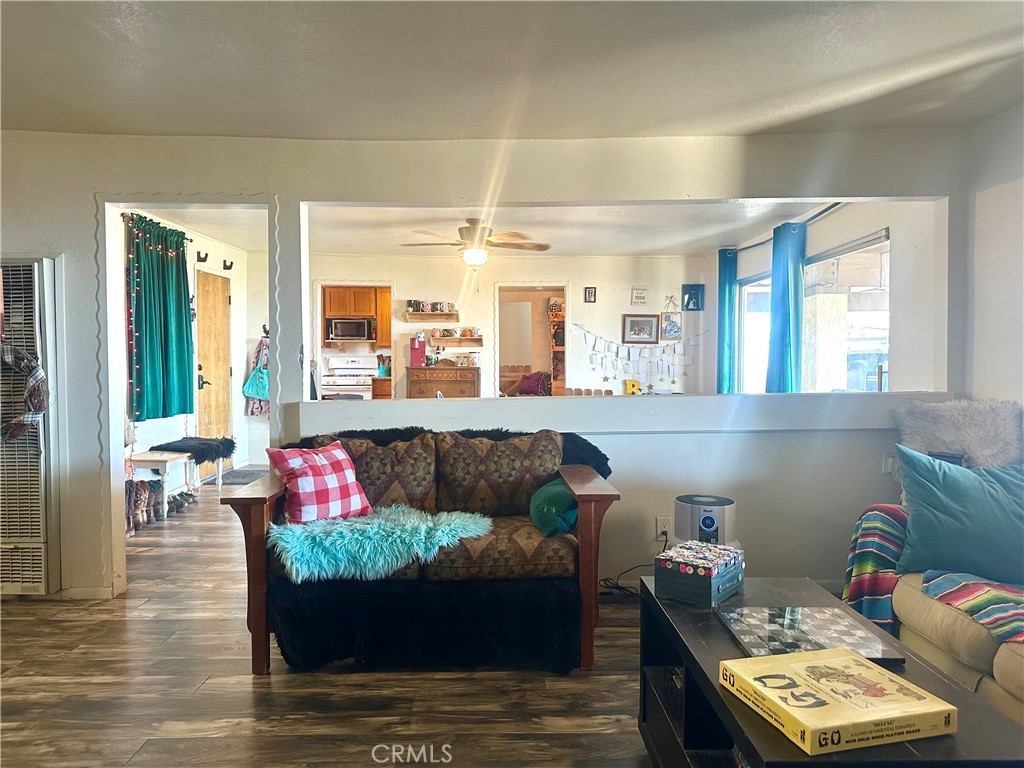 20320 Roads End Drive Perris, CA 92570 - Photo 7 of 21 a living room with furniture and a table