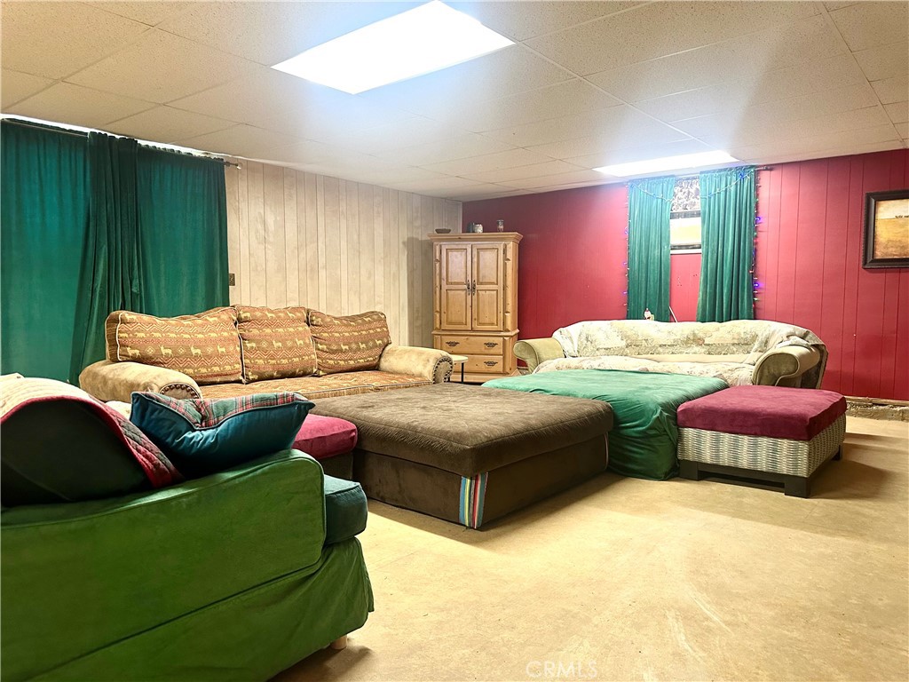 20320 Roads End Drive Perris, CA 92570 - Photo 10 of 21 a bedroom with a bed couch and window