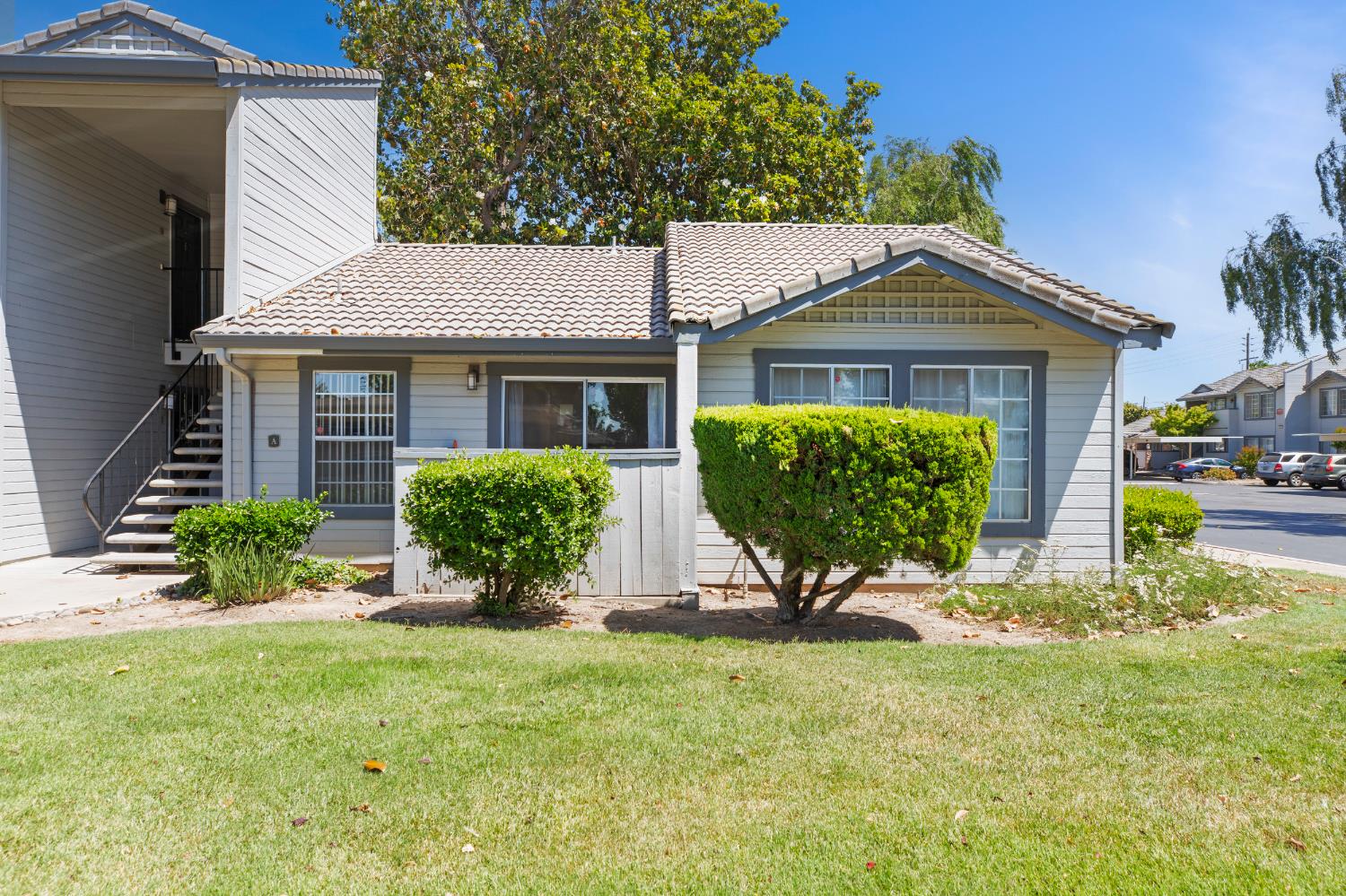 a front view of a house with garden