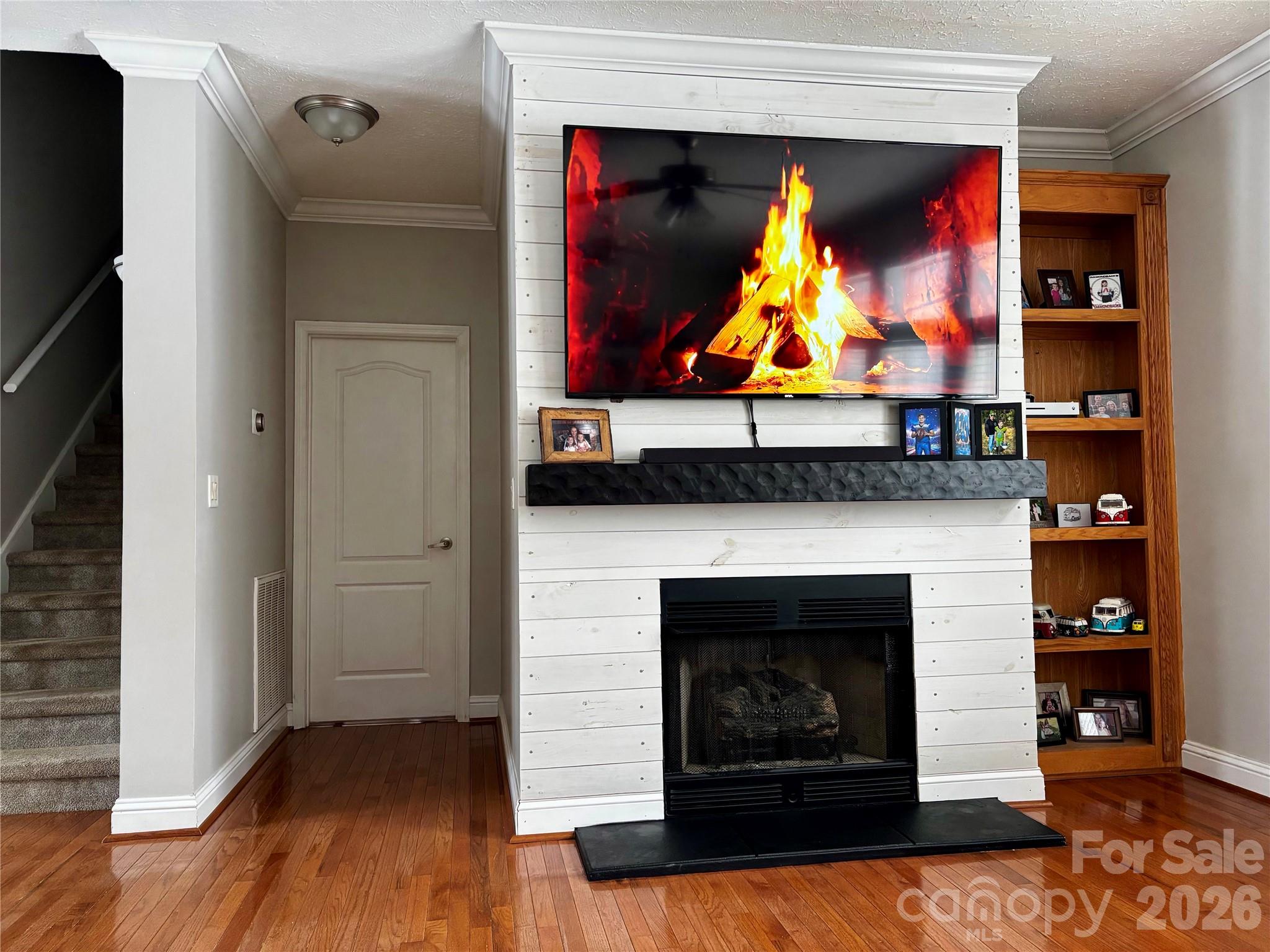 2533 Lail Road Morganton, NC 28655 - Photo 12 of 38 a room with fireplace and wooden floor