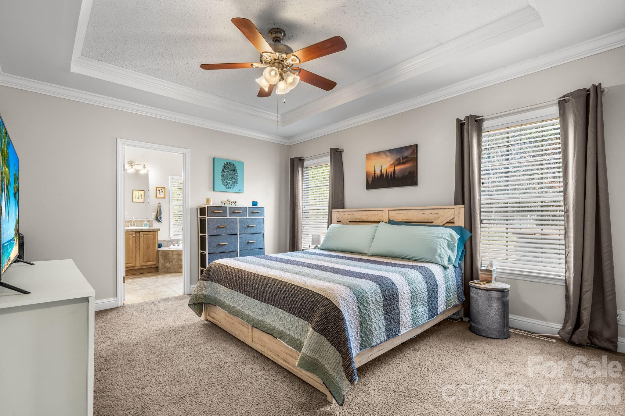 2533 Lail Road Morganton, NC 28655 - Photo 13 of 38 a bedroom with a bed and a chandelier