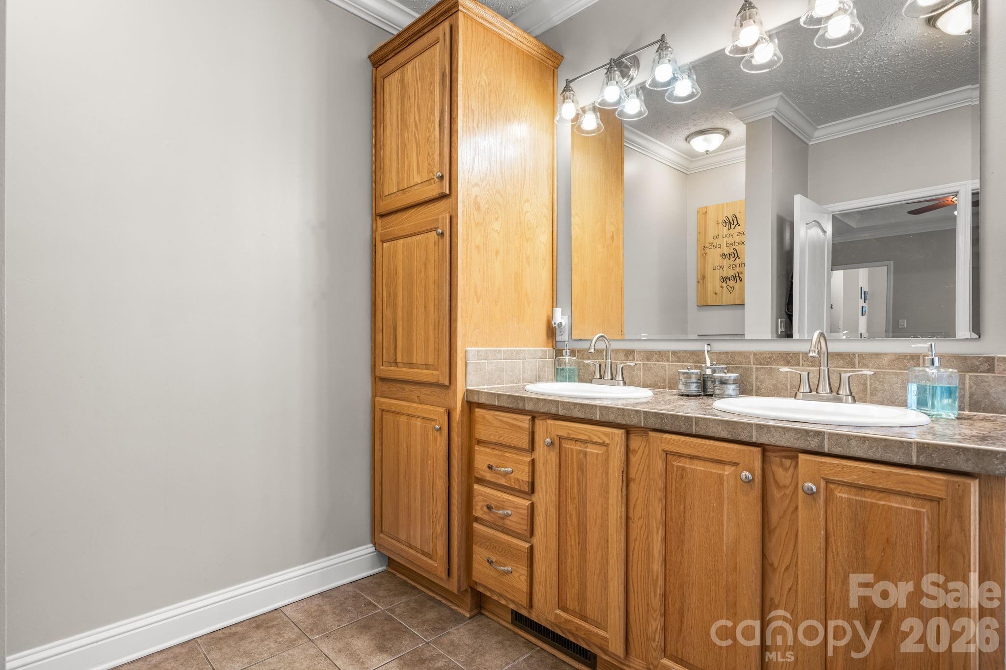 2533 Lail Road Morganton, NC 28655 - Photo 14 of 38 a bathroom with a double vanity sink and a mirror