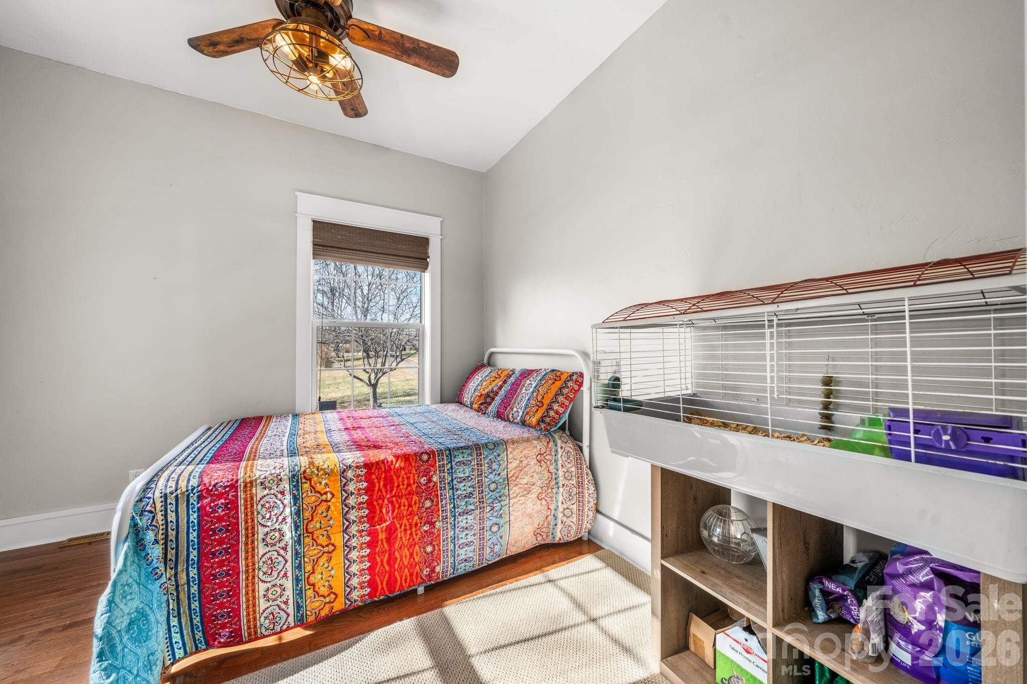 2533 Lail Road Morganton, NC 28655 - Photo 18 of 38 a living room with a bed furniture and a window