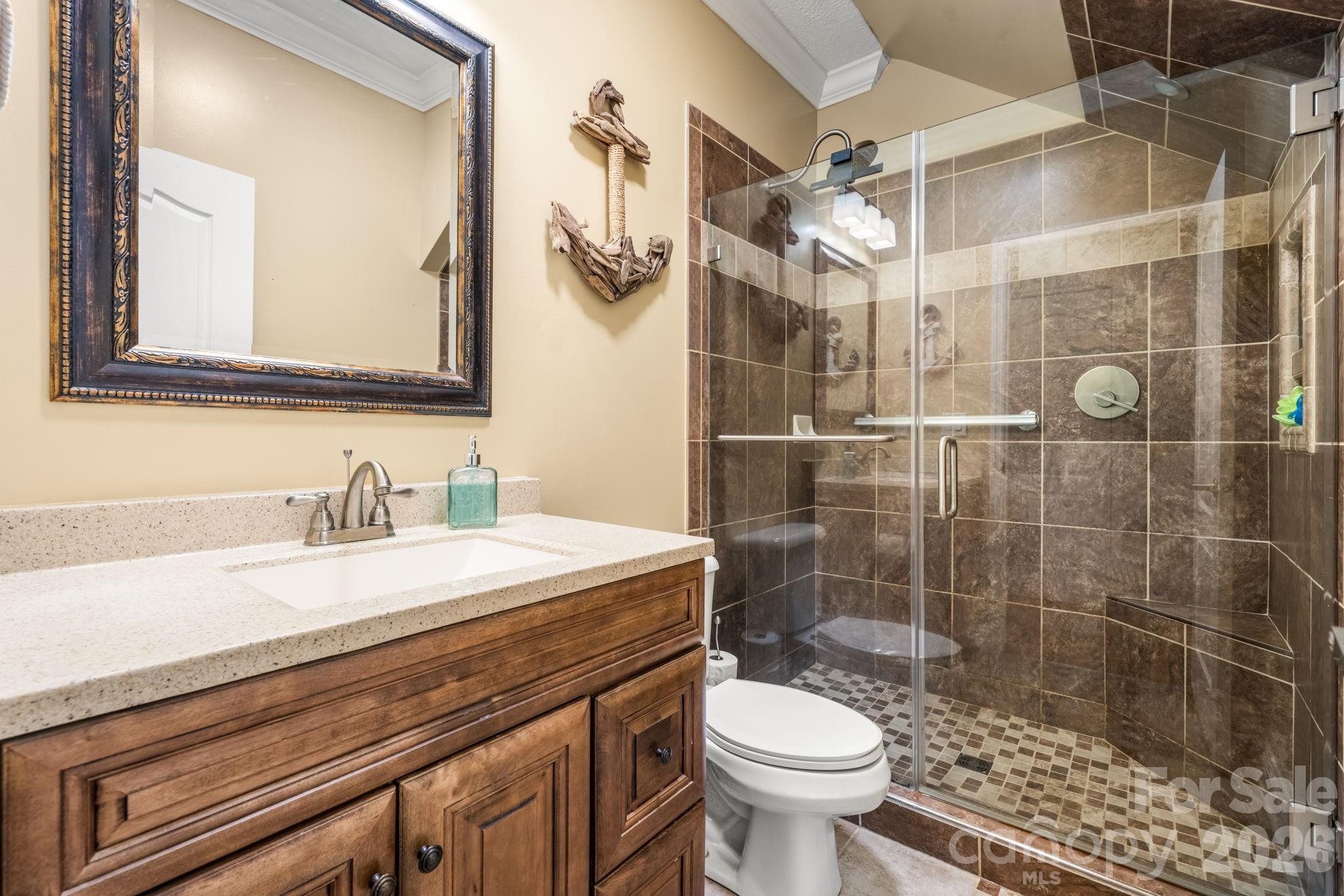 2533 Lail Road Morganton, NC 28655 - Photo 20 of 38 a bathroom with a sink a toilet and shower