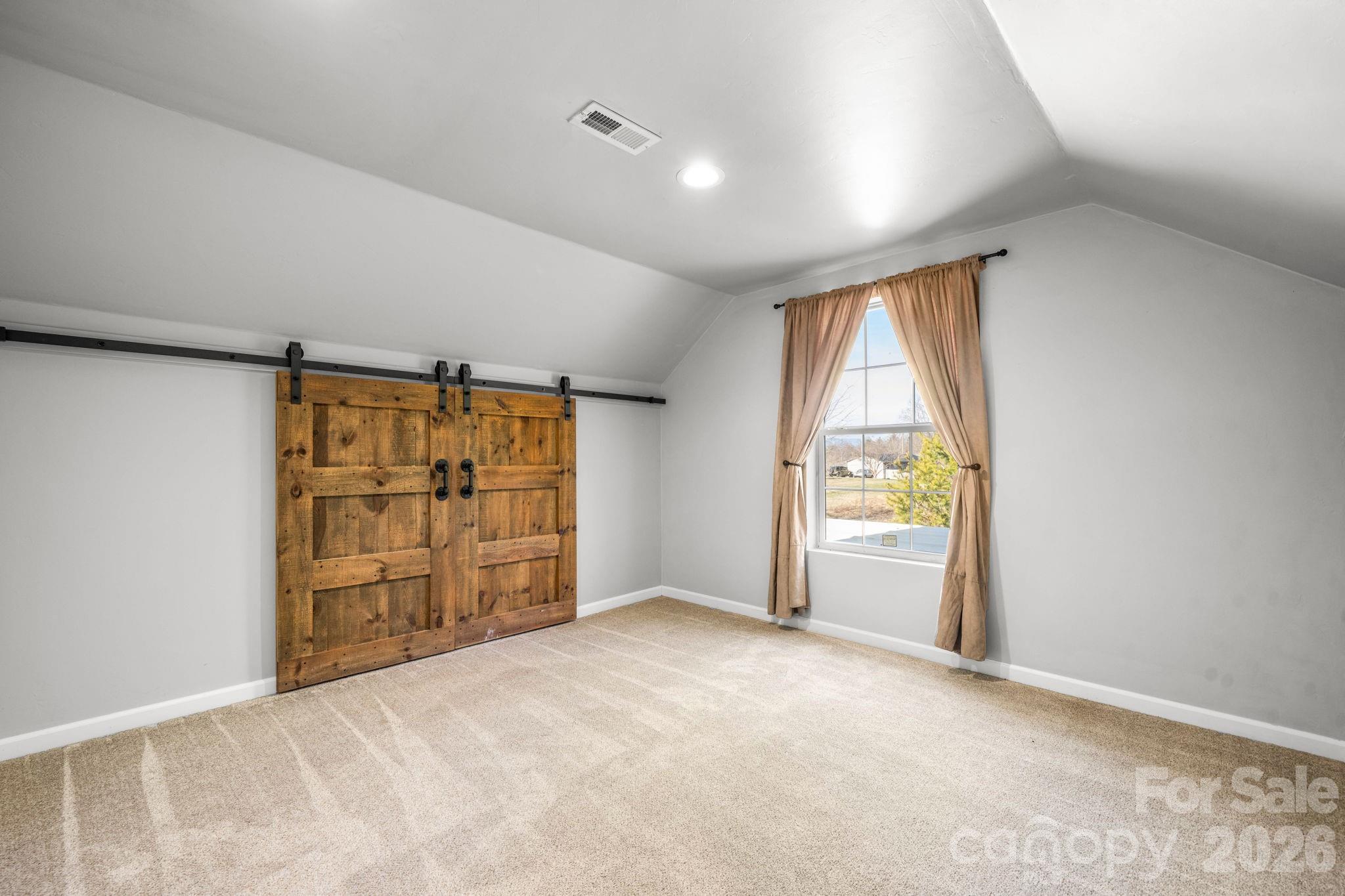 2533 Lail Road Morganton, NC 28655 - Photo 21 of 38 an empty room with window and furniture