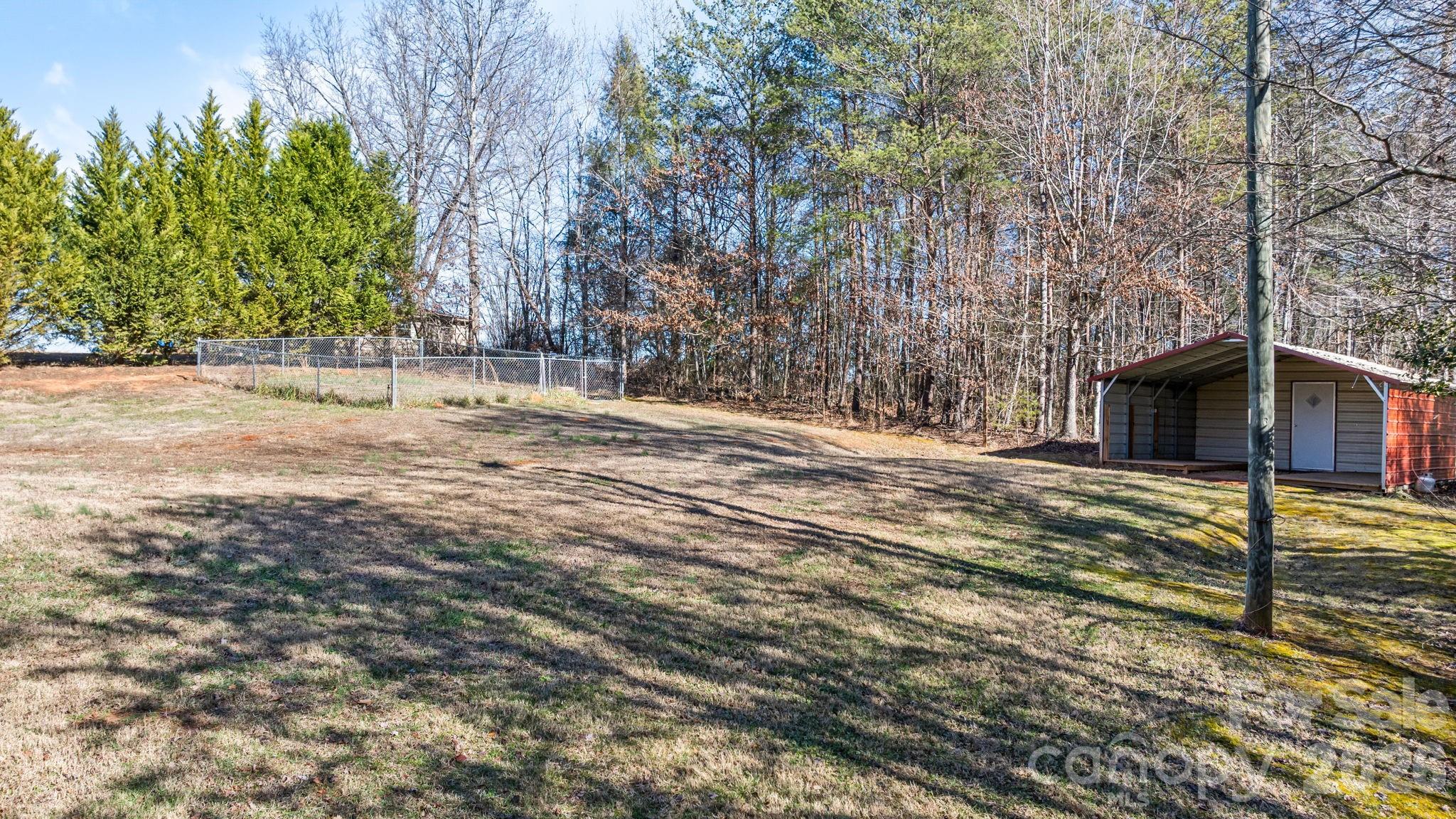2533 Lail Road Morganton, NC 28655 - Photo 29 of 38 a view of backyard space and trees