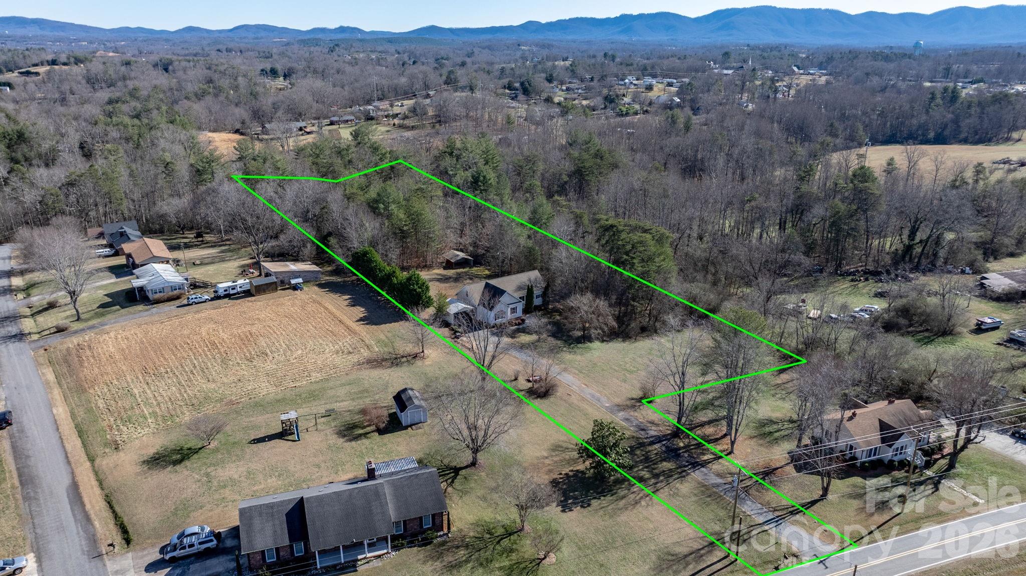 2533 Lail Road Morganton, NC 28655 - Photo 37 of 38 an aerial view of a house with mountain view