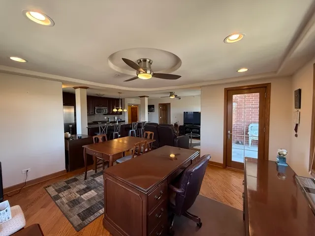 a living room with furniture a rug and a window
