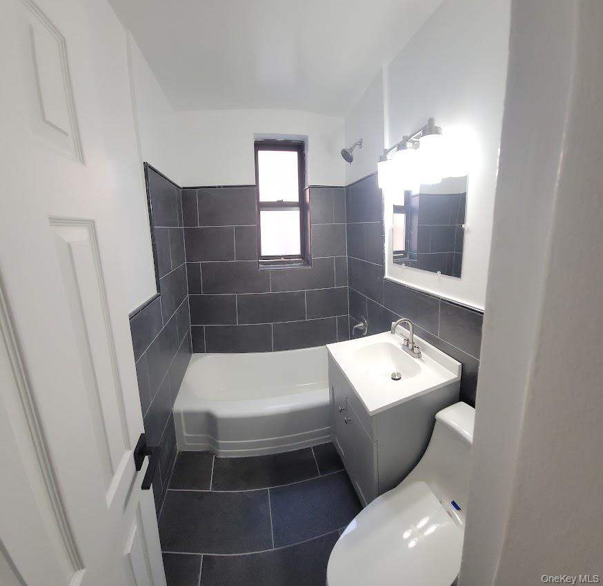 141-60 84th Road, Unit 2G Queens, NY 11435 - Photo 11 of 11 a bathroom with a toilet and a sink