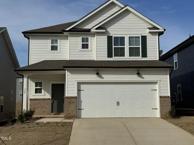 a view of a house with garage