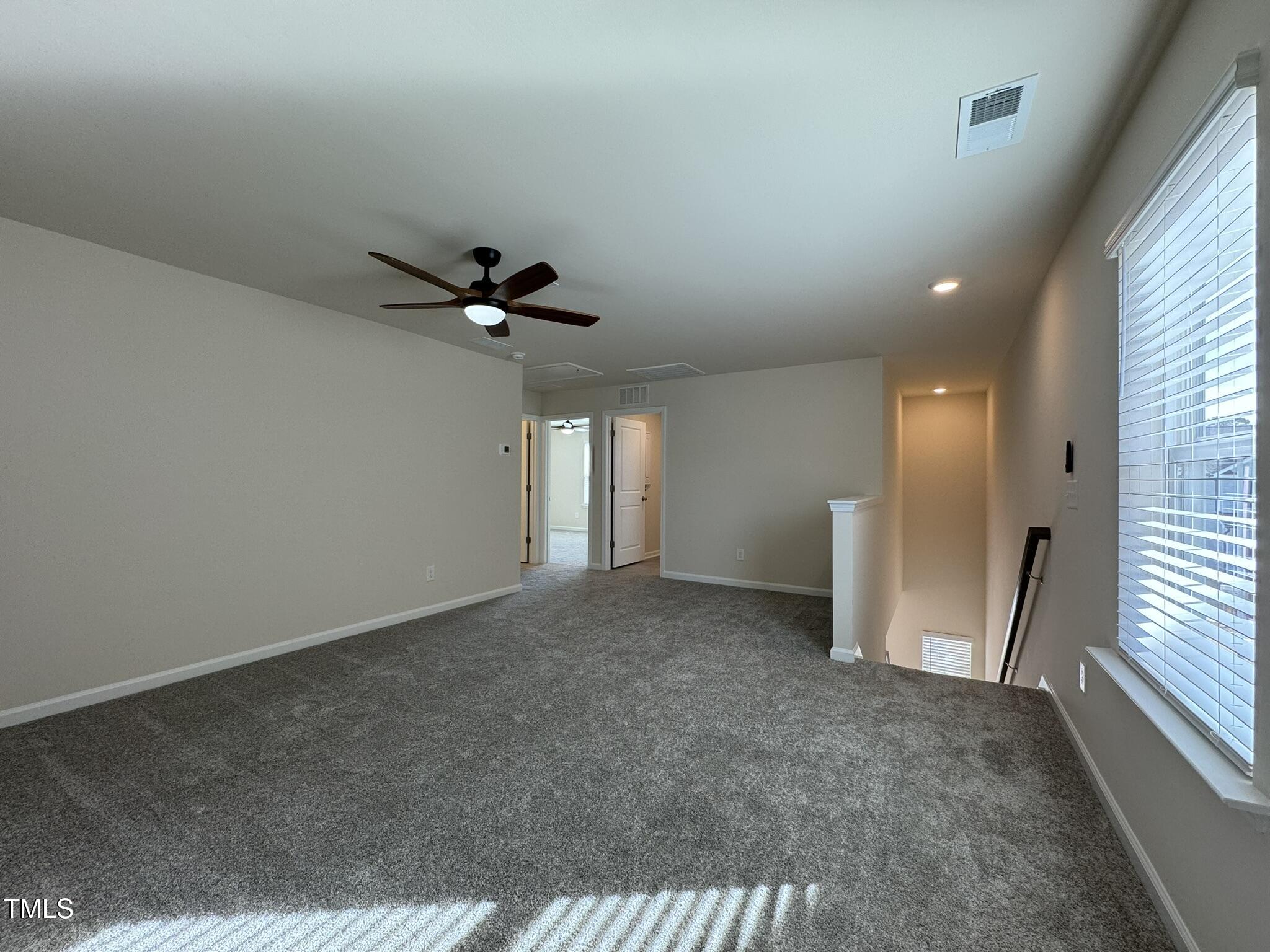 128 Katrine Way Raleigh, NC 27603 - Photo 13 of 34 a view of an empty room and a window