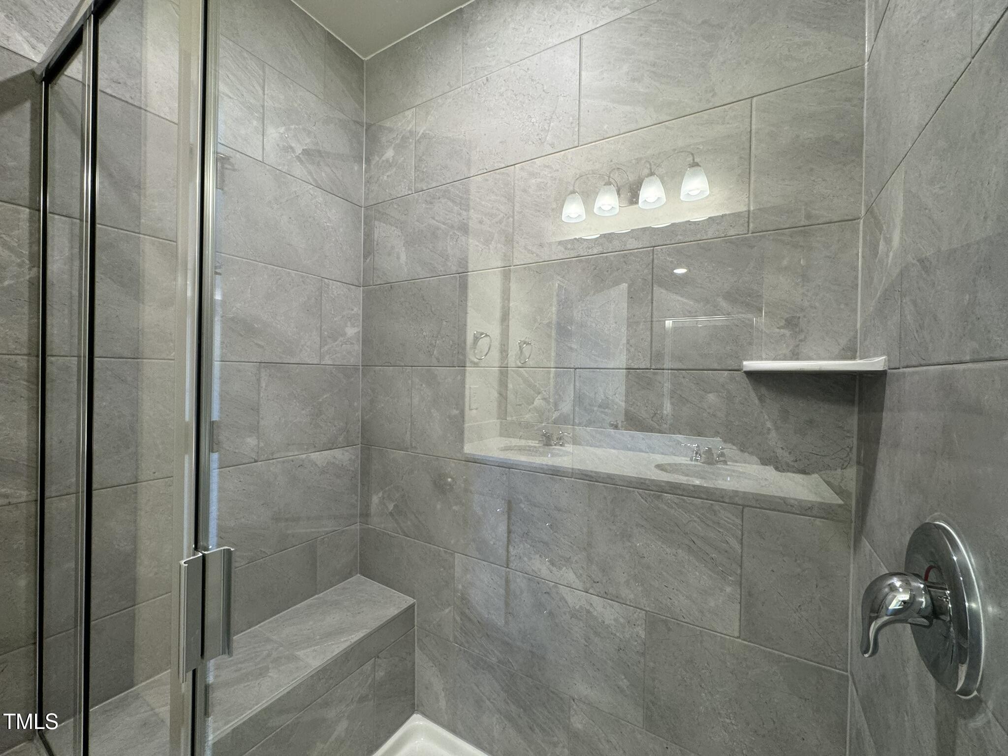 128 Katrine Way Raleigh, NC 27603 - Photo 17 of 34 a bathroom with a shower