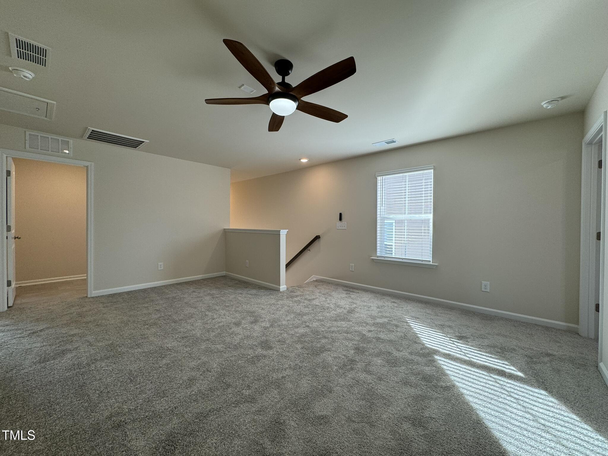 128 Katrine Way Raleigh, NC 27603 - Photo 20 of 34 a view of a livingroom with a ceiling fan and window