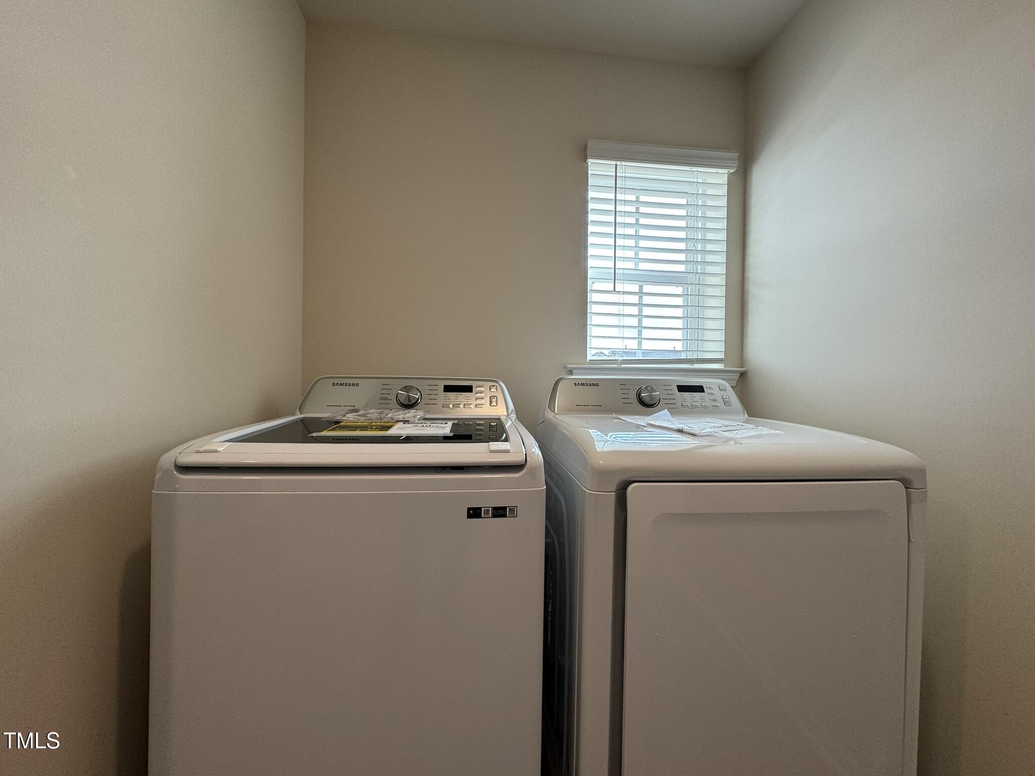 128 Katrine Way Raleigh, NC 27603 - Photo 22 of 34 a utility room with dryer and washer