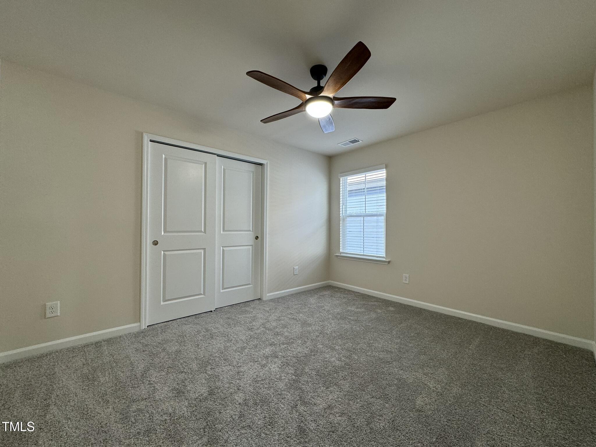 128 Katrine Way Raleigh, NC 27603 - Photo 23 of 34 an empty room with closet and windows