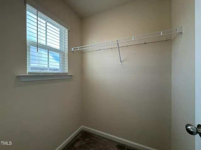 a view of a small space with racks on the wall