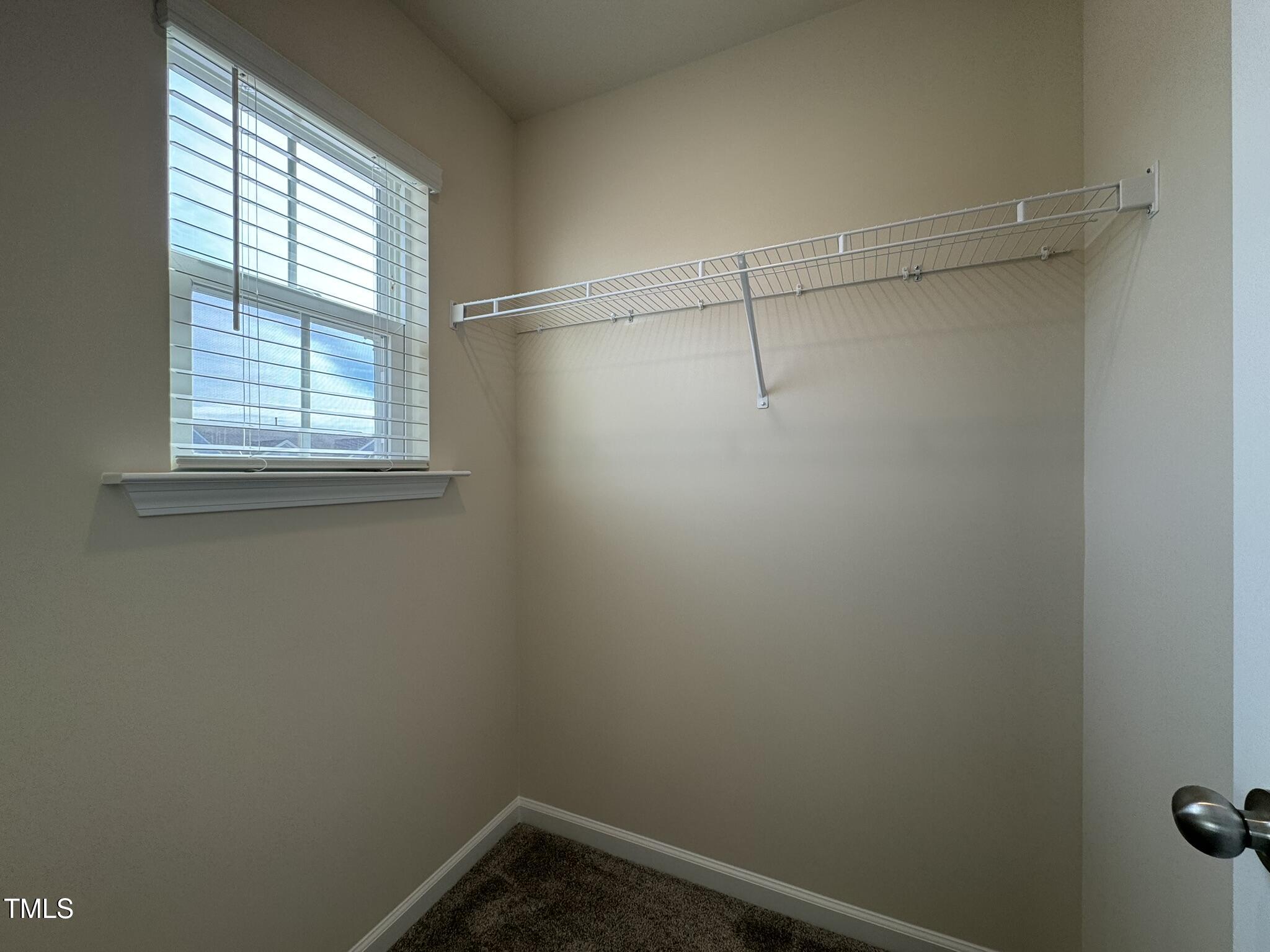 128 Katrine Way Raleigh, NC 27603 - Photo 26 of 34 a view of a small space with racks on the wall