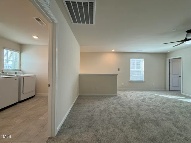 a view of a kitchen with a sink and cabinets