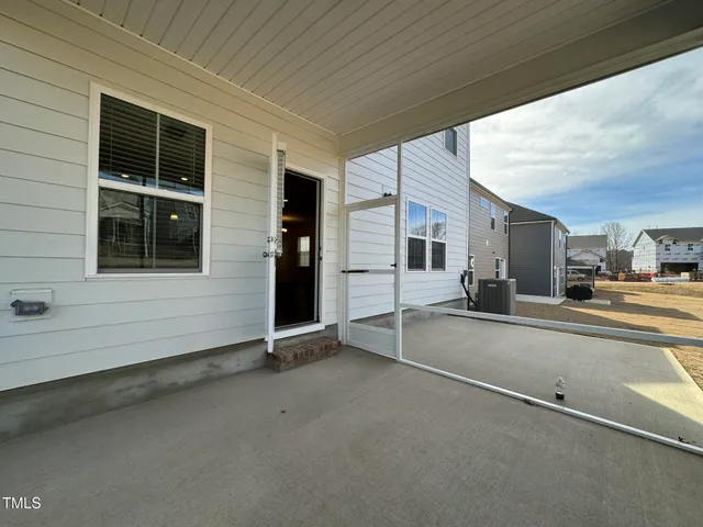 a view of a house with a street