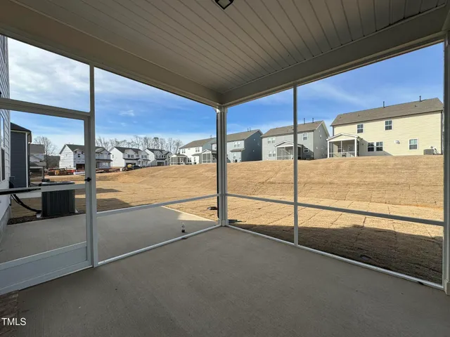 a view of a hall with an empty space and window