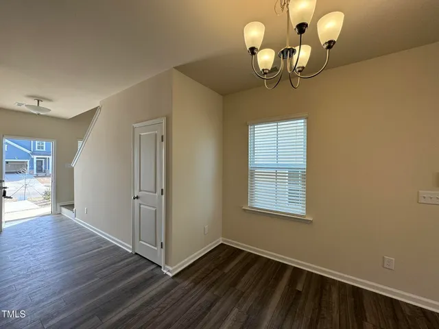 a view of a livingroom with wooden floor
