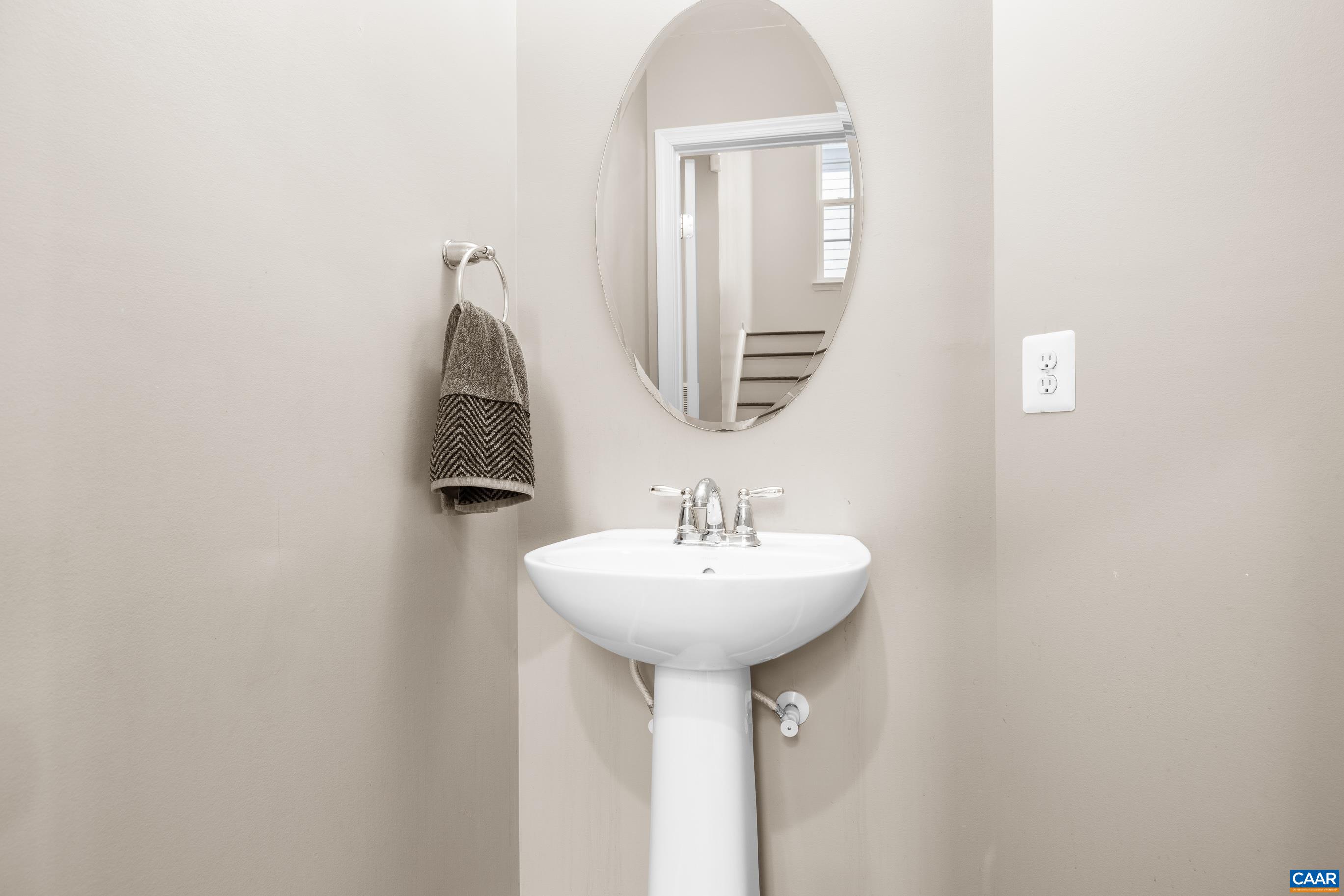 1838 Wickham Place Charlottesville, VA 22901 - Photo 17 of 53 a bathroom with a sink a mirror and vanity