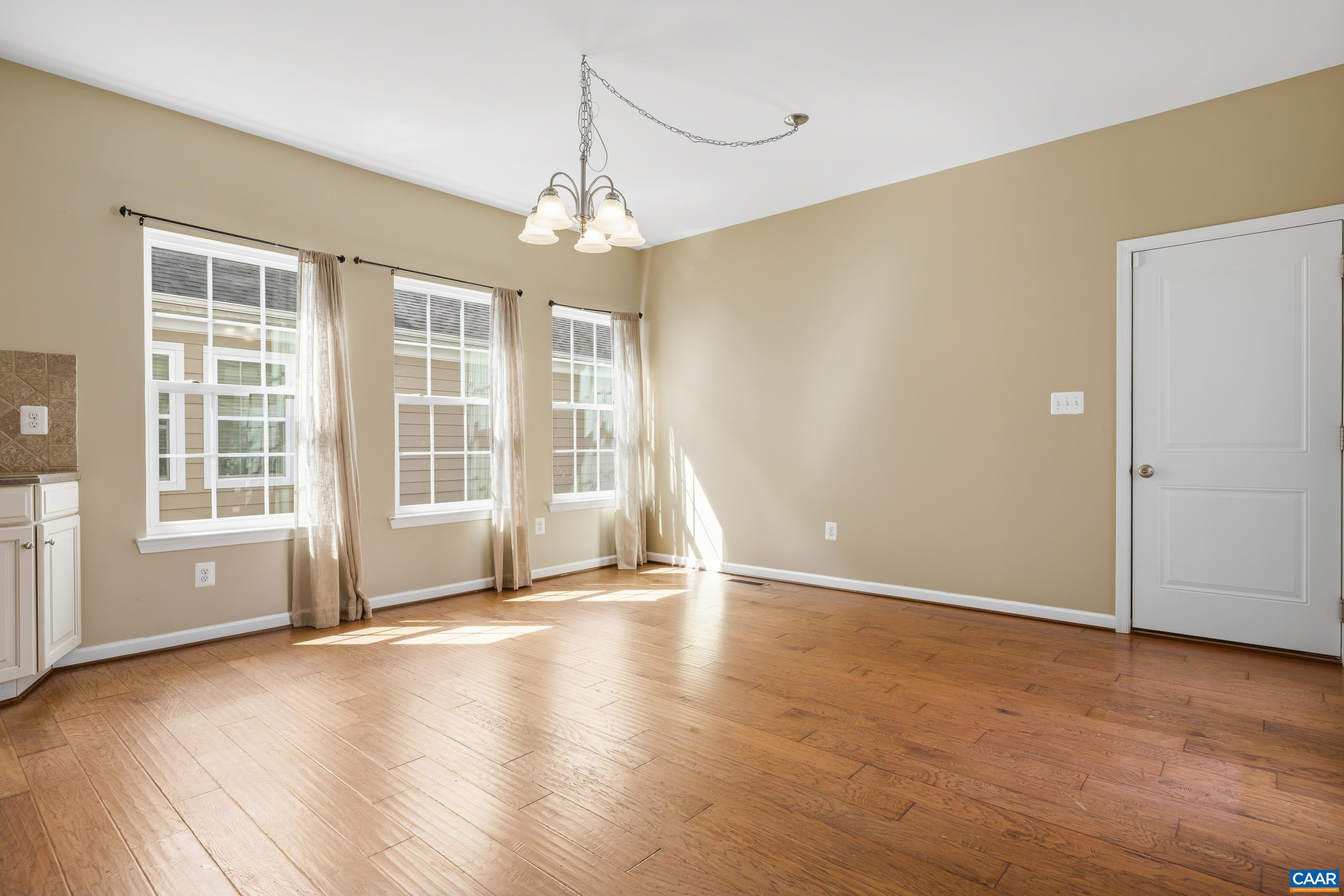 1838 Wickham Place Charlottesville, VA 22901 - Photo 21 of 53 a view of an empty room with wooden floor and a window
