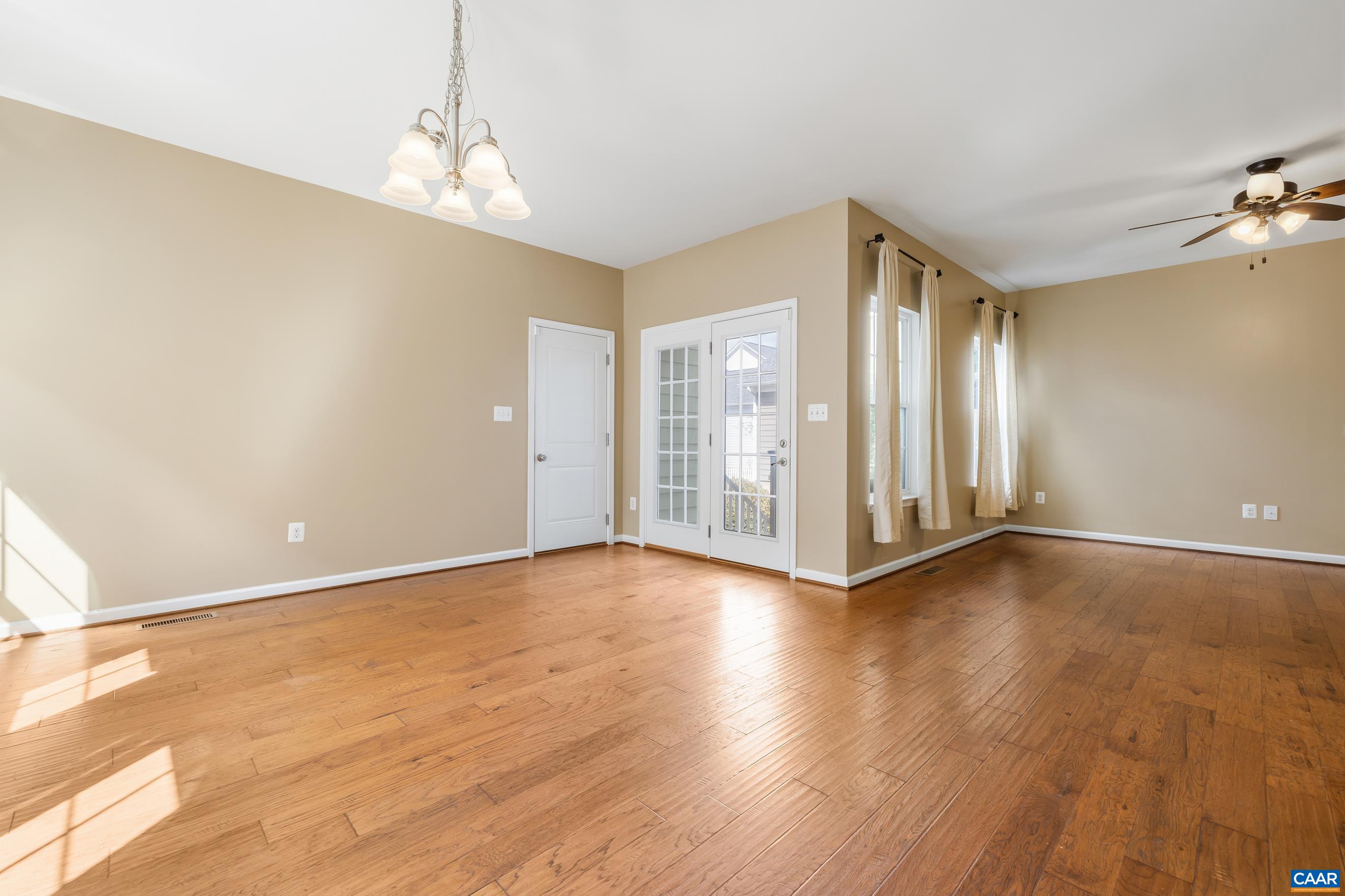 1838 Wickham Place Charlottesville, VA 22901 - Photo 23 of 53 an empty room with wooden floor and windows
