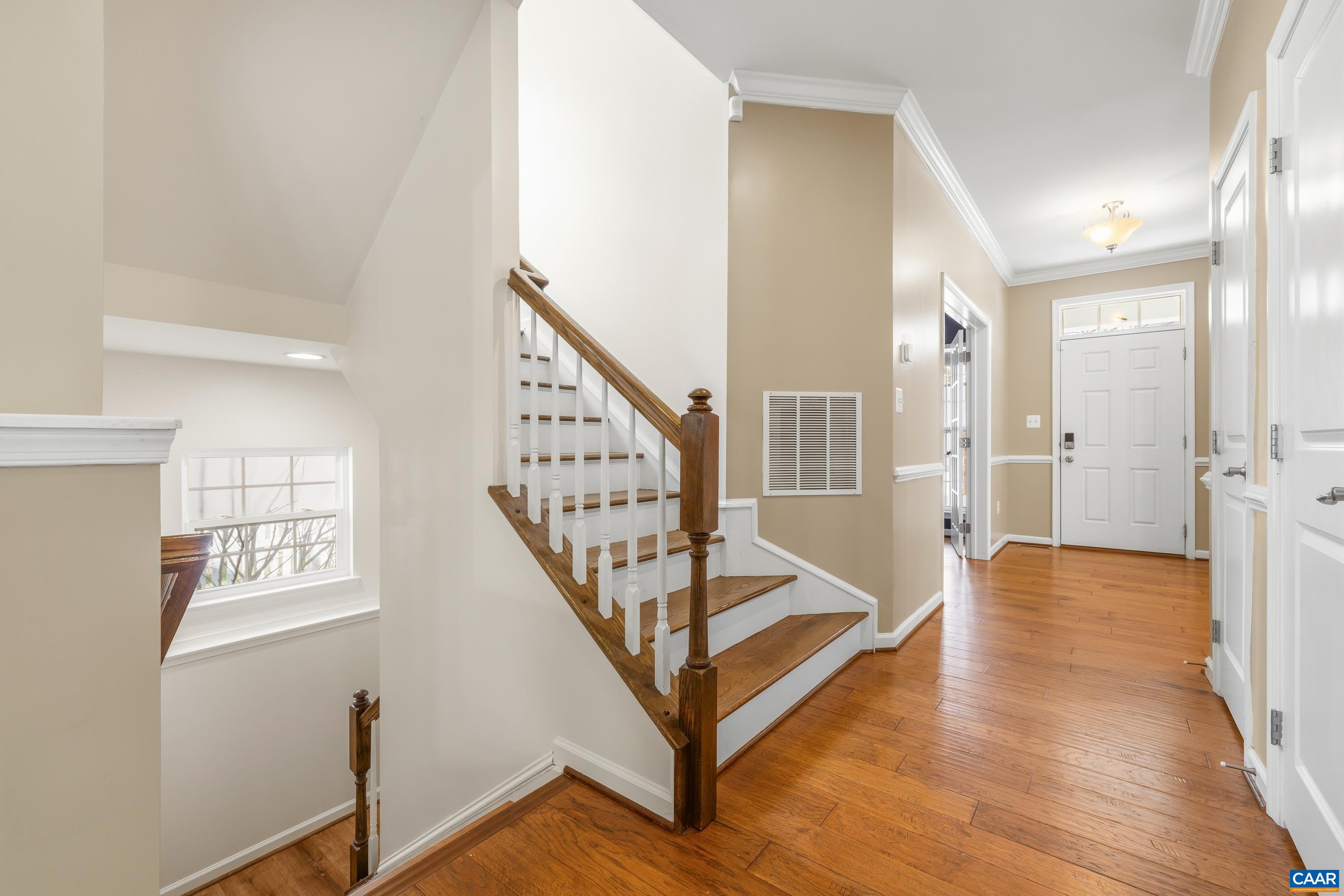 1838 Wickham Place Charlottesville, VA 22901 - Photo 29 of 53 a view of an entryway with wooden floor and stairs