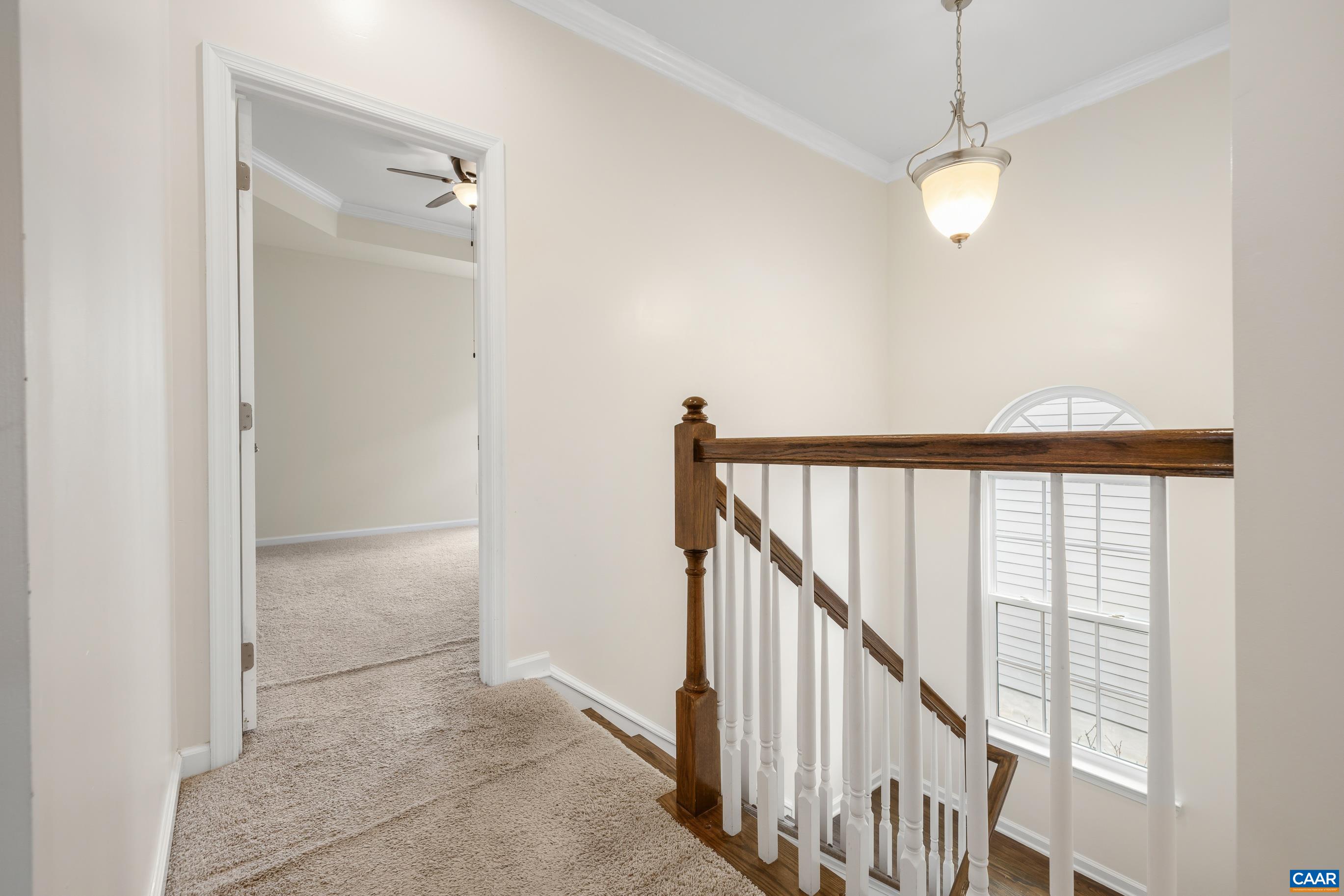 1838 Wickham Place Charlottesville, VA 22901 - Photo 39 of 53 a view of a hallway with wooden floor and staircase