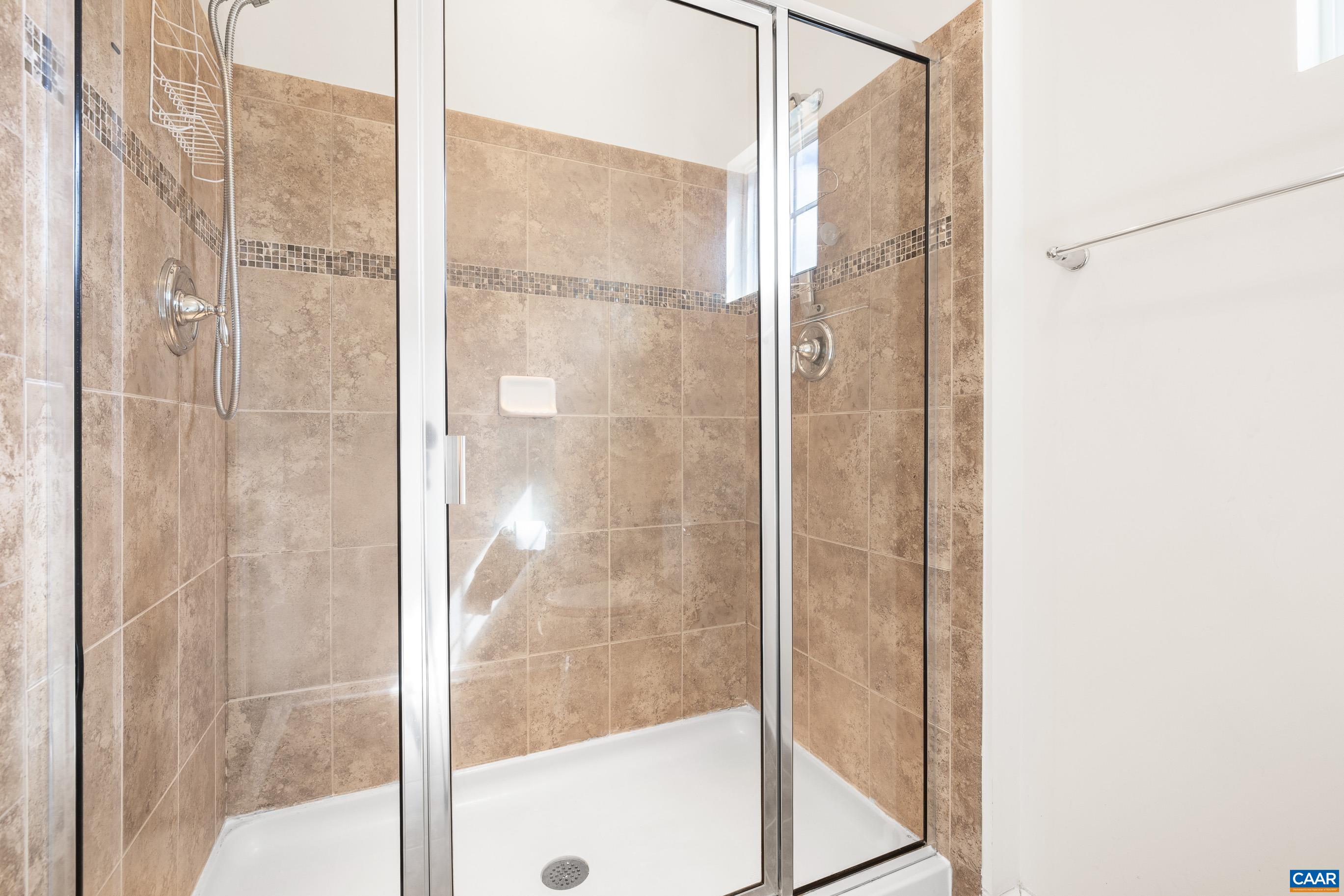 1838 Wickham Place Charlottesville, VA 22901 - Photo 43 of 53 a bathroom with a glass shower door