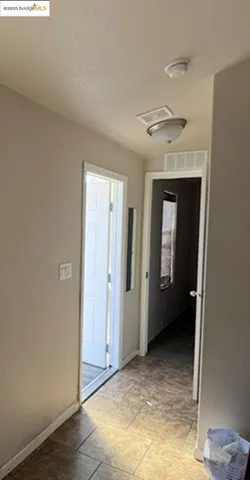 a view of a room with a hallway