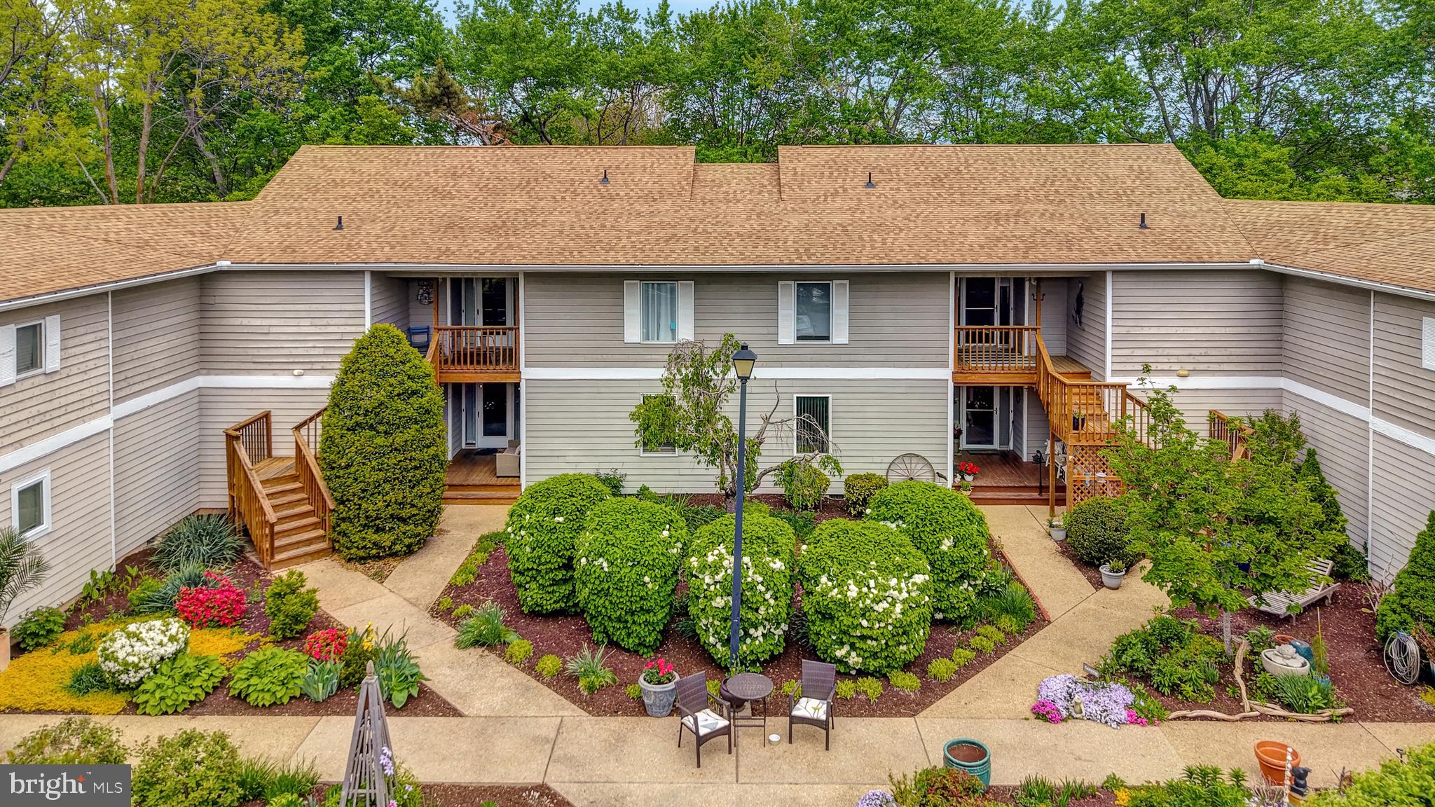 18540 Drayton Hall Road, Unit 2 Lewes, DE 19958 - Photo 1 of 38 front view of a house with potted plants