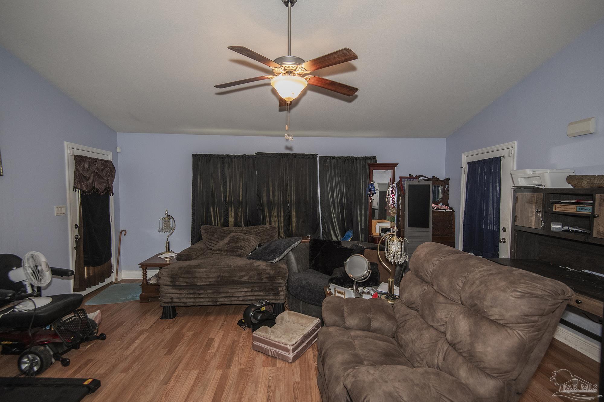 5800 Providence Loop Pensacola, FL 32526 - Photo 11 of 29 a living room with furniture and a wooden floor