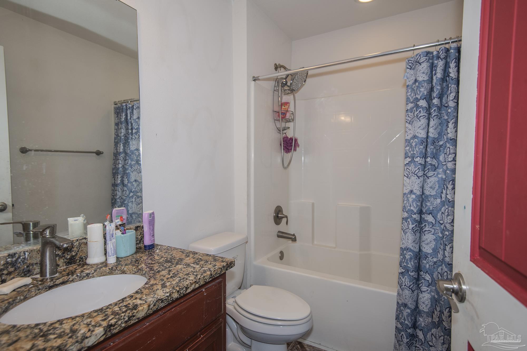 5800 Providence Loop Pensacola, FL 32526 - Photo 12 of 29 a bathroom with a granite countertop sink toilet and shower