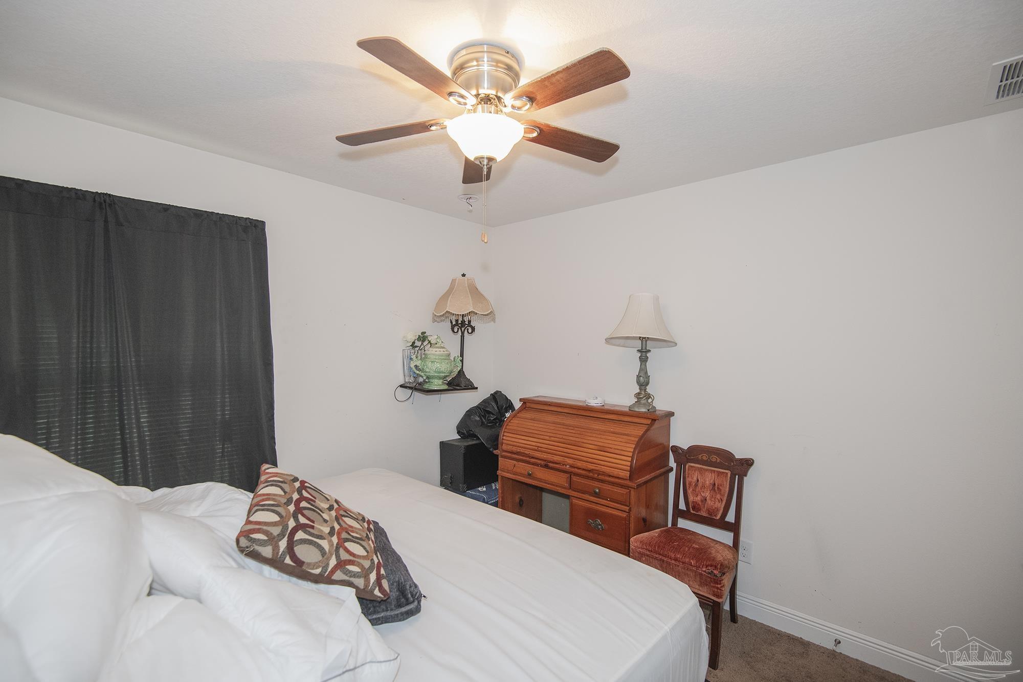 5800 Providence Loop Pensacola, FL 32526 - Photo 15 of 29 a bedroom with bed and a chandelier