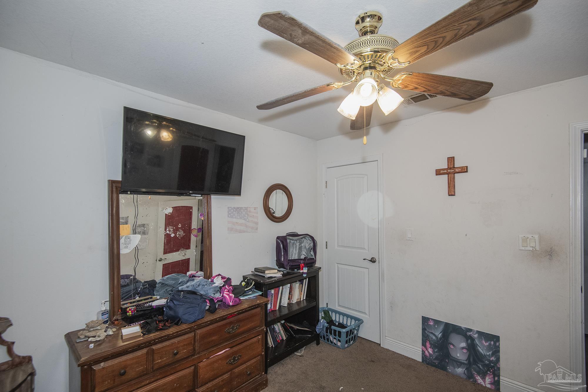 5800 Providence Loop Pensacola, FL 32526 - Photo 18 of 29 a living room with furniture and a flat screen tv
