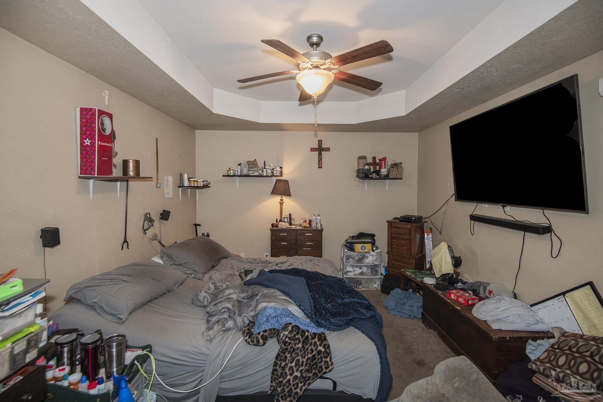 5800 Providence Loop Pensacola, FL 32526 - Photo 20 of 29 a bedroom with a bed and a flat screen tv