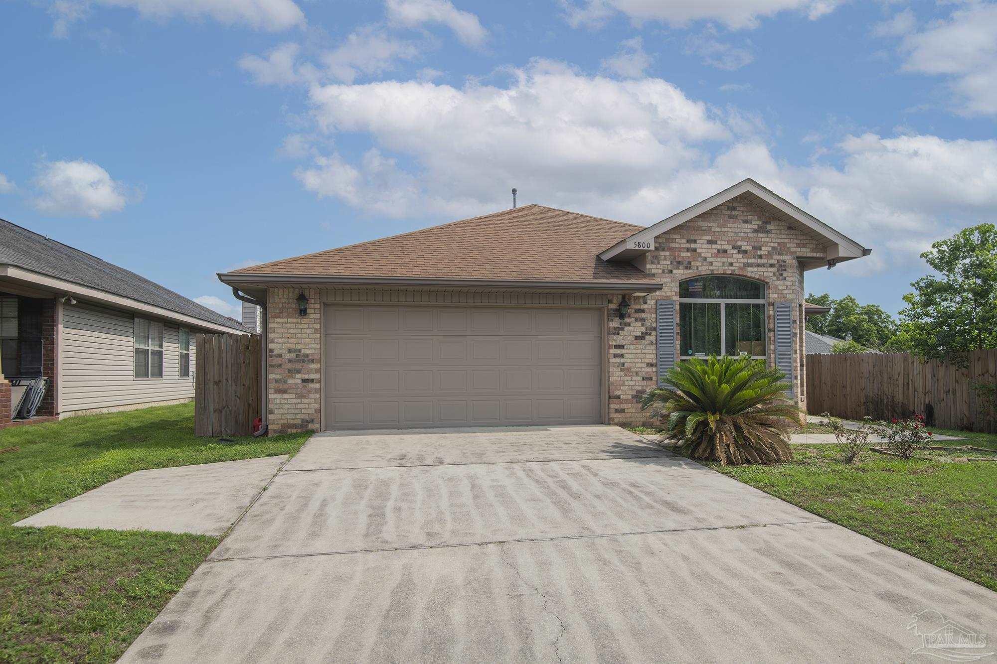 5800 Providence Loop Pensacola, FL 32526 - Photo 2 of 29 a front view of house with yard and trees