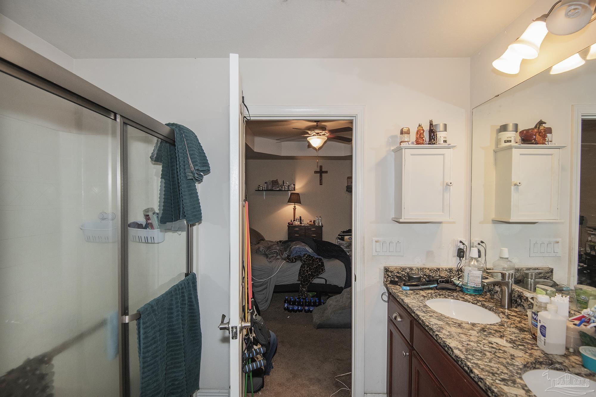 5800 Providence Loop Pensacola, FL 32526 - Photo 23 of 29 a bathroom with a granite countertop sink and a mirror