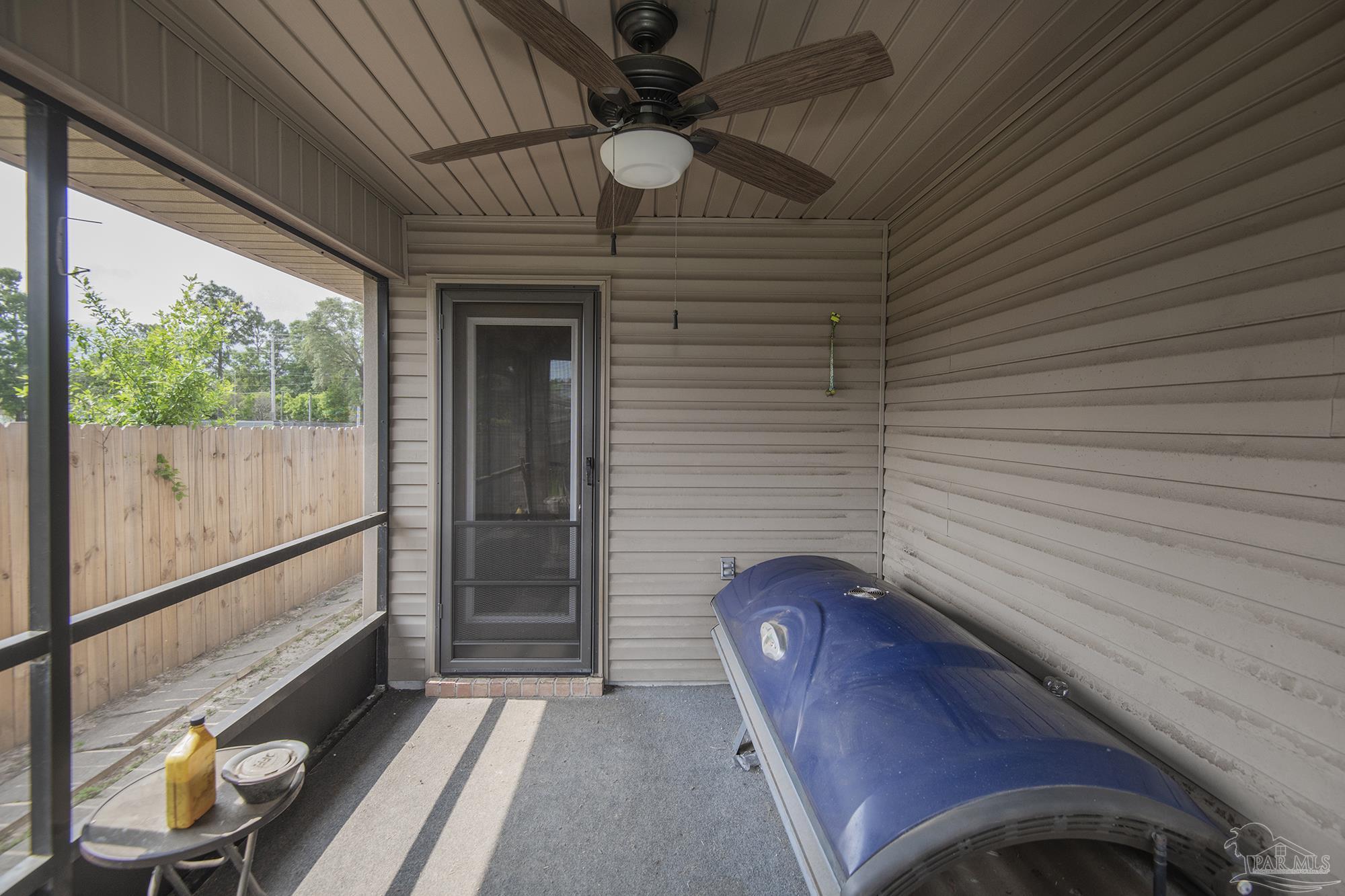 5800 Providence Loop Pensacola, FL 32526 - Photo 28 of 29 a view of a hallway with wooden floor and windows
