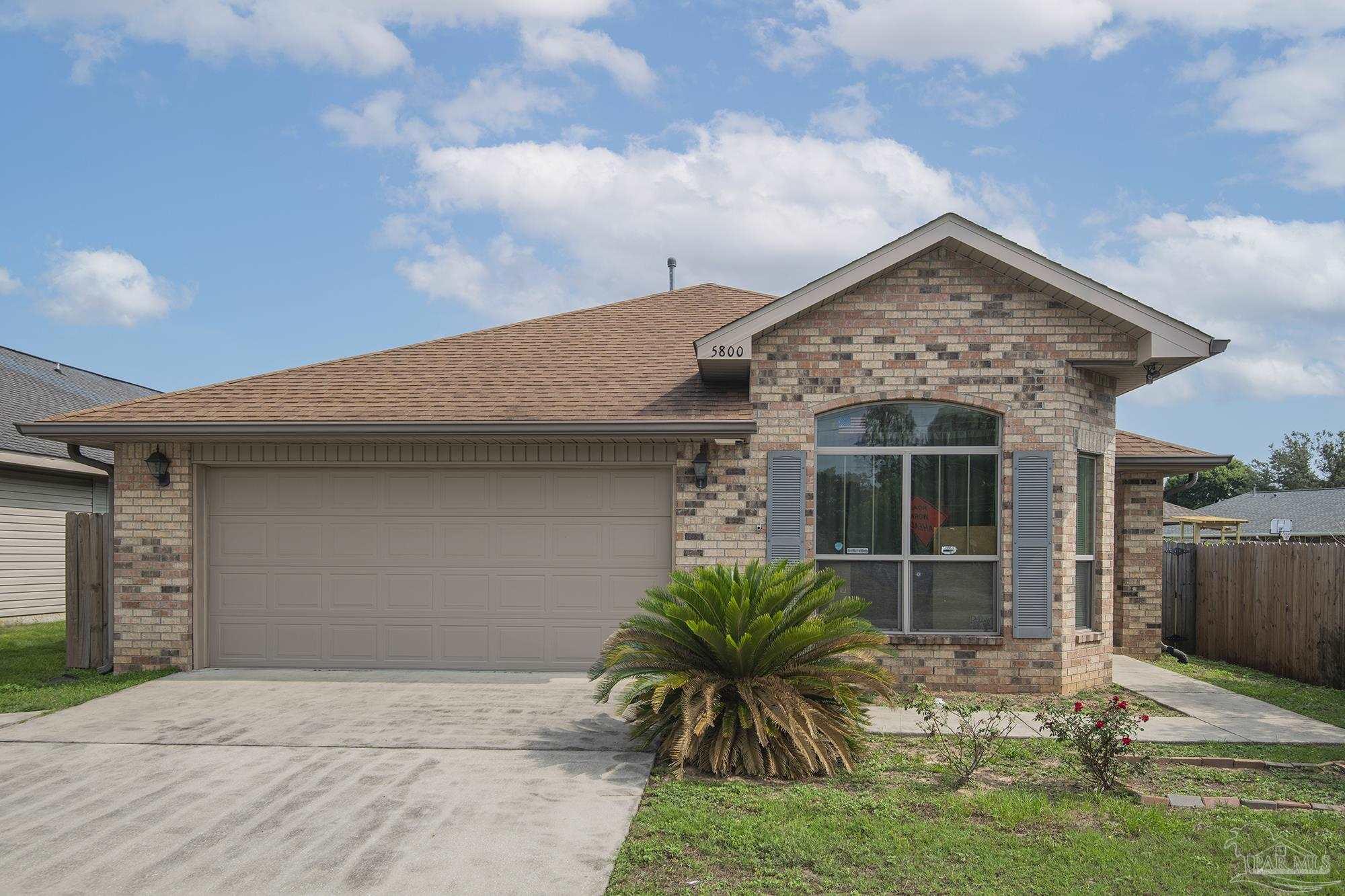5800 Providence Loop Pensacola, FL 32526 - Photo 3 of 29 a front view of a house with garden