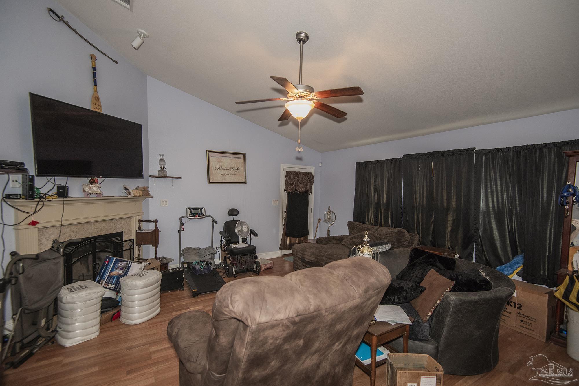 5800 Providence Loop Pensacola, FL 32526 - Photo 8 of 29 a living room with furniture and a flat screen tv