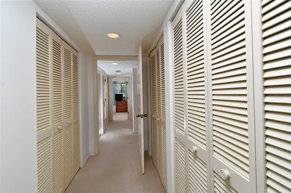 a view of a hallway with a window