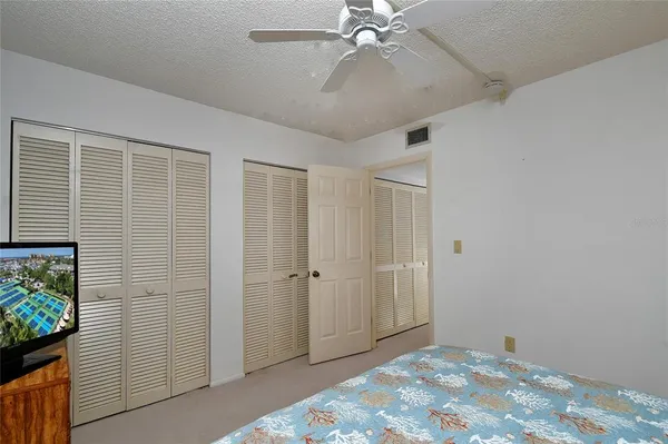 a view of a livingroom with a chandelier fan
