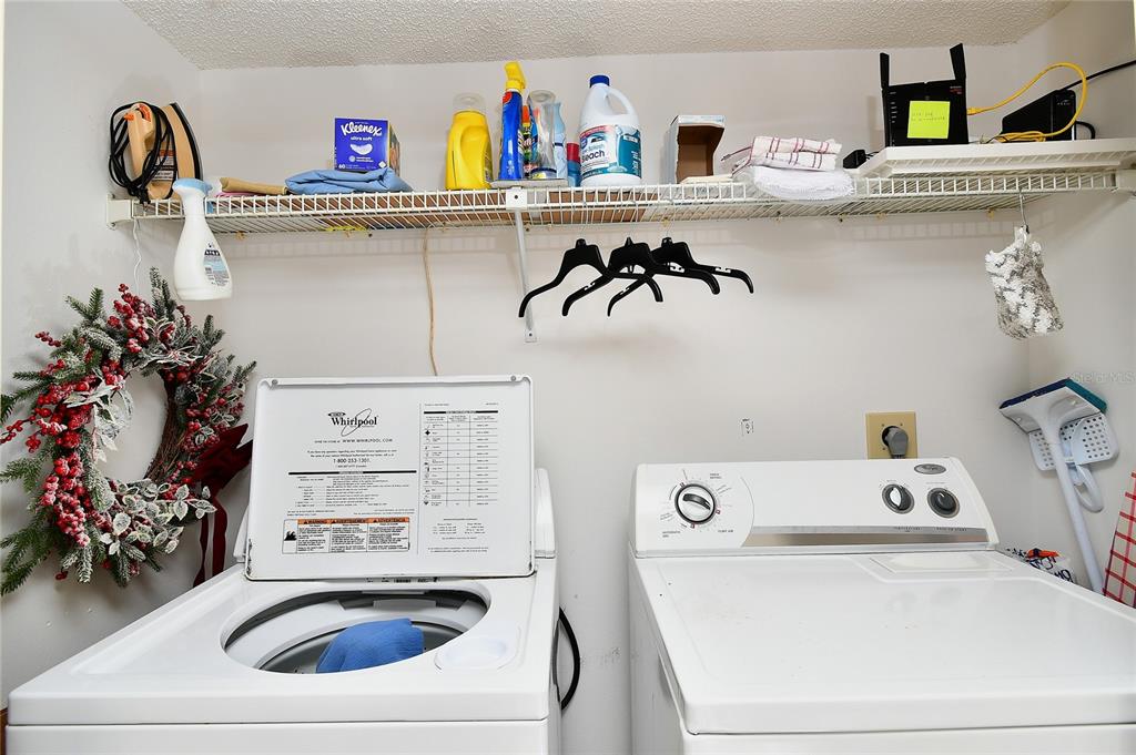 601 Islamorada Boulevard, Unit 24B Punta Gorda, FL 33955 - Photo 28 of 36 a utility room with sink washer and dryer