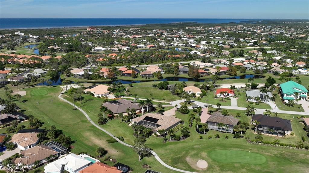 601 Islamorada Boulevard, Unit 24B Punta Gorda, FL 33955 - Photo 33 of 36 an aerial view of residential houses with outdoor space and trees