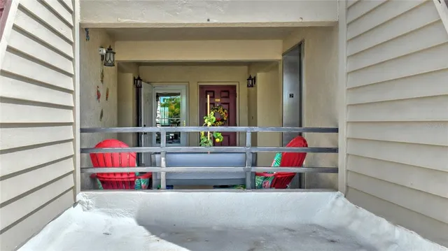 a living room with furniture and a book shelf