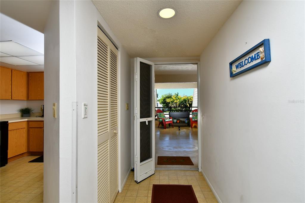 601 Islamorada Boulevard, Unit 24B Punta Gorda, FL 33955 - Photo 7 of 36 a view of a hallway and dining room