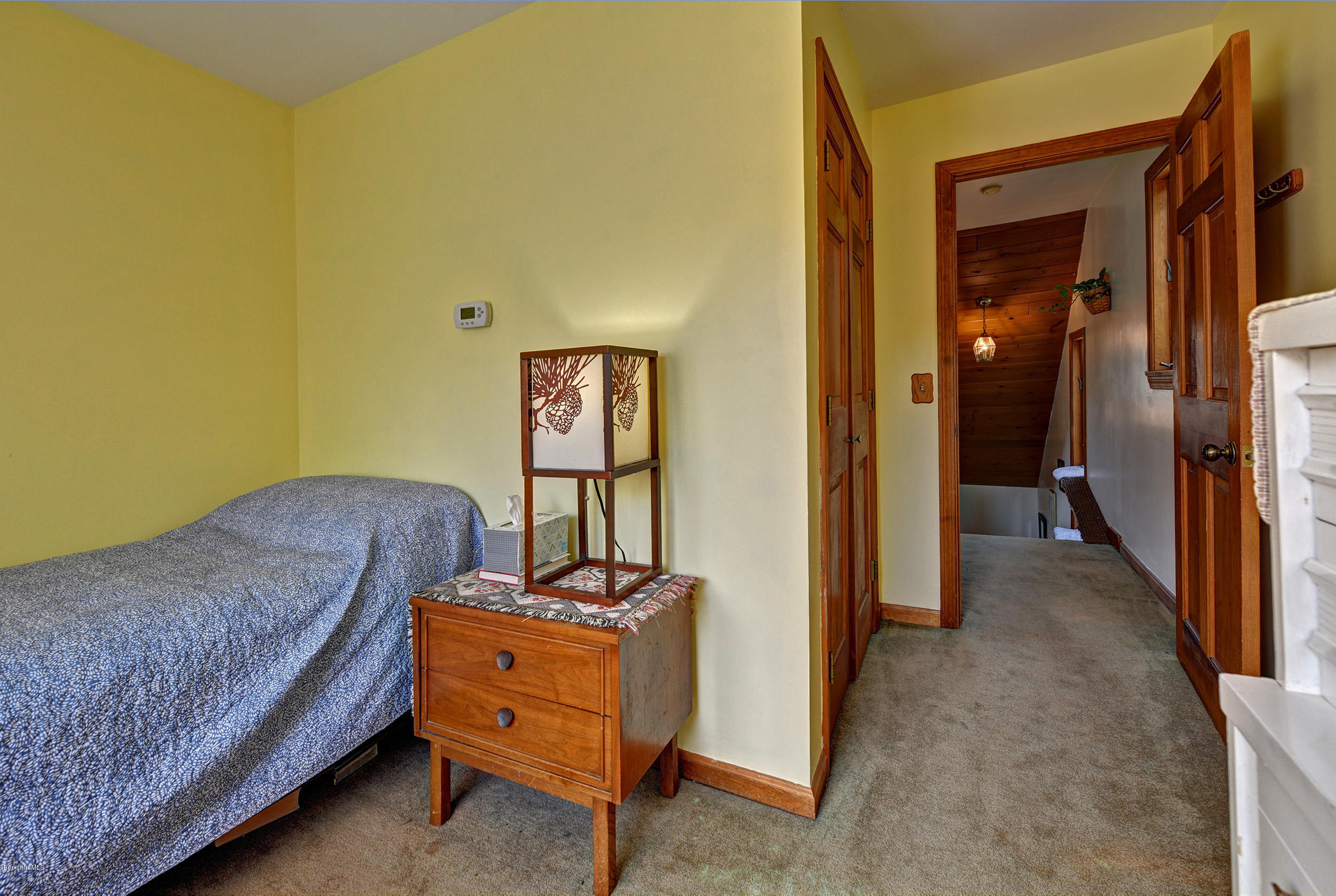 26 Andes Road Peru, MA 01235 - Photo 14 of 52 a bedroom with a bed and a chandelier
